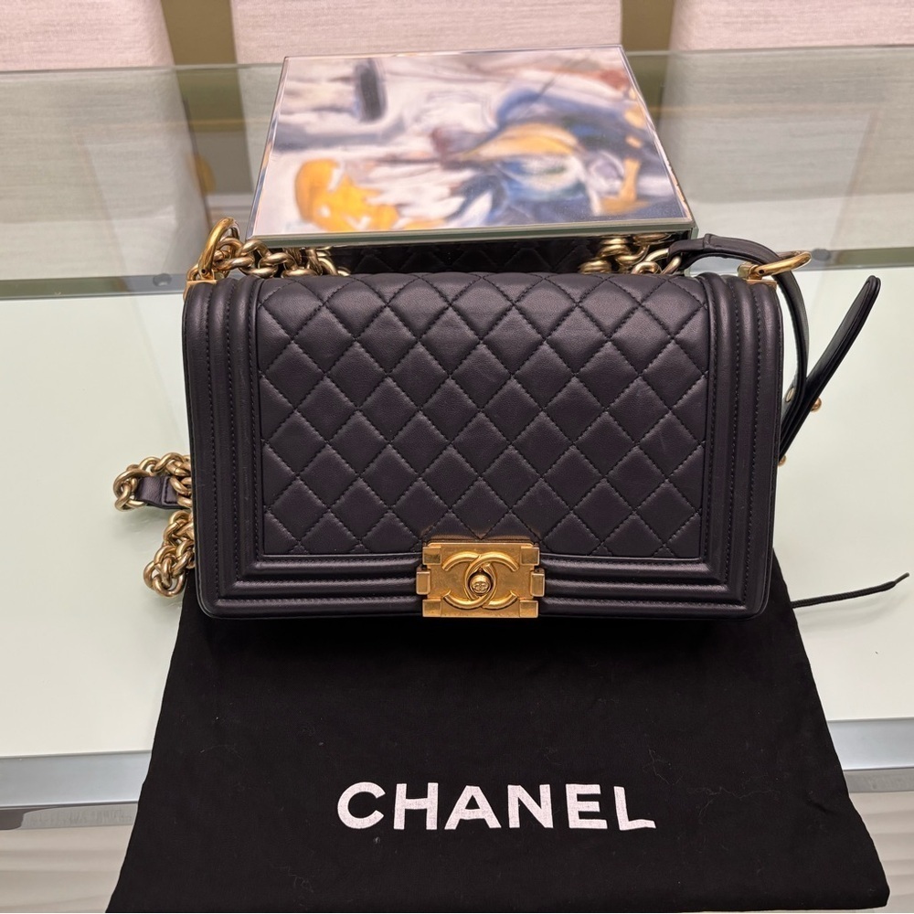 Authentic Chanel Quilted Médium Boy Flap Bag in Navy Blue